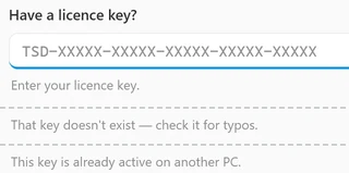 The Have a licence key? box of the Upgrade window and the line the app shows under it after three tries: Enter your licence key. for an empty box, That key doesn’t exist — check it for typos. for a made-up key, and a line starting This key is already active on another PC. for a key that’s active on another PC